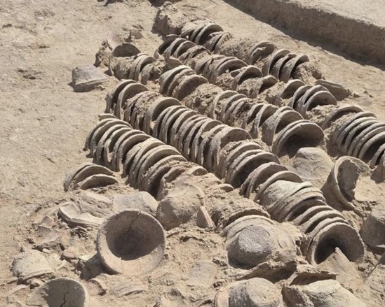 Rows of ancient pottery uncovered at an archaeological excavation in Kurdistan